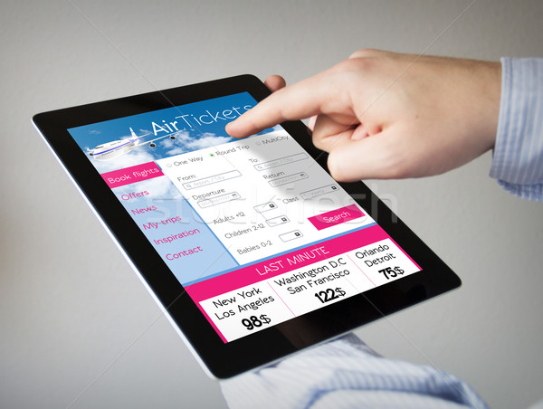ticket flight application on a tablet Stock photo © georgejmclittle