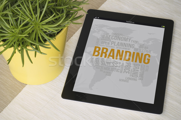 Tablet branding over a table with plant Stock photo © georgejmclittle