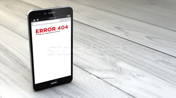smartphone error 404 over white wooden background Stock photo © georgejmclittle