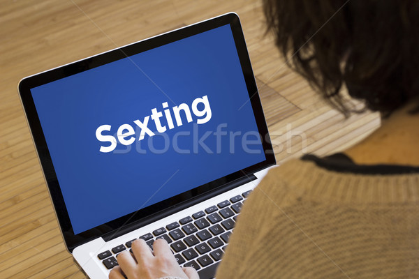 woman computer sexting Stock photo © georgejmclittle