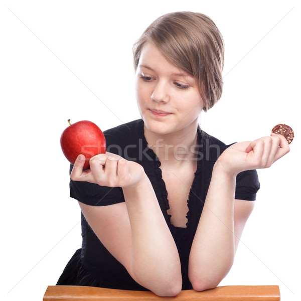 Tijd beslissing jonge vrouw kiezen appel chocolade Stockfoto © georgemuresan