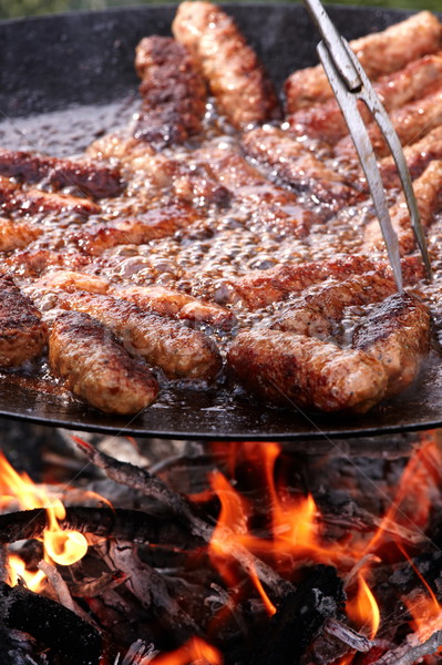 Gotowania spełniają grillowany mięsa ognia Zdjęcia stock © georgemuresan