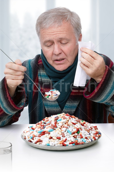 Ziek man senior overdreven behandeling drugs Stockfoto © georgemuresan