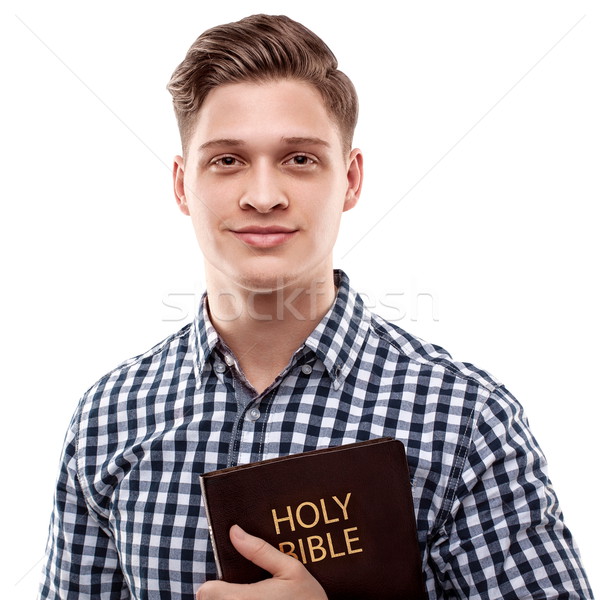 Feliz religioso homem jovem bonito Foto stock © georgemuresan