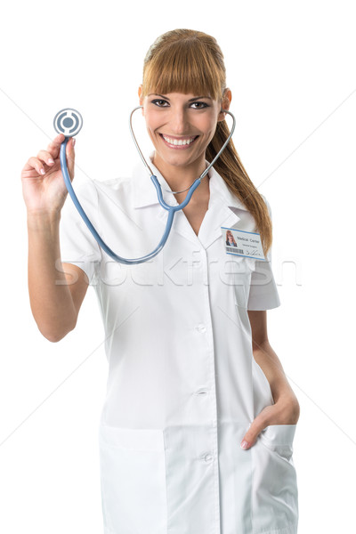 Smiling Doctor in white medical gown ,showing stetoscope Stock photo © Geribody