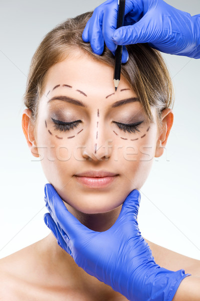 Plastic surgery - Beautiful woman face, with surgical markings  Stock photo © Geribody