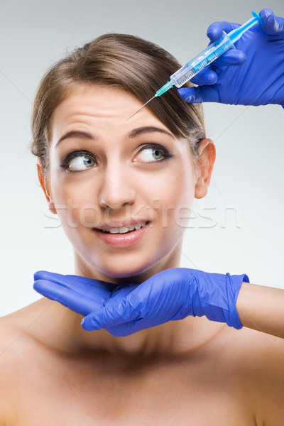 Mooie vrouw plastische chirurgie angst naald meisje gezicht Stockfoto © Geribody