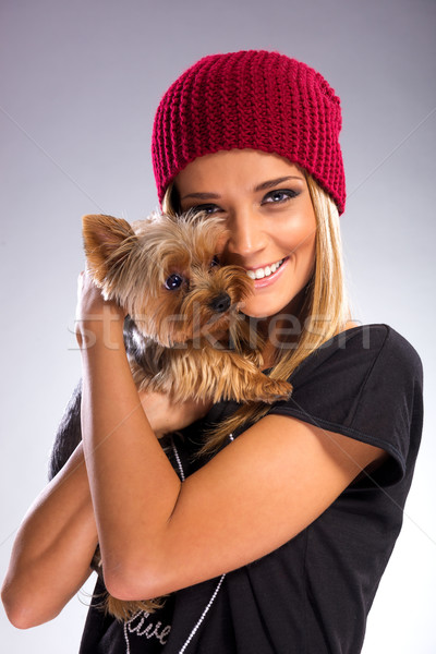 Stock photo: Beautiful woman with autumn fashion, holding yorkshire terrier dog