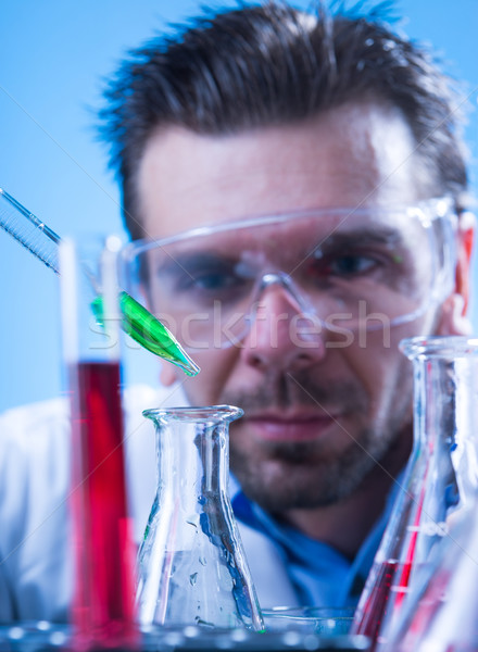 Laboratory equipment,  Man in the lab experimenting Stock photo © Geribody