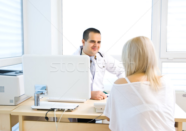 A doctor asks the patient's symptoms Stock photo © Geribody