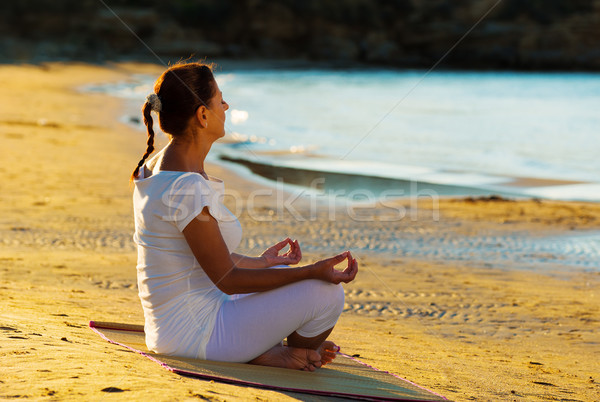 healthy middle aged woman doing fitness stretching outdoors Stock photo © Geribody
