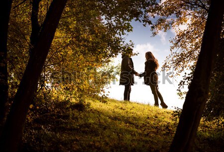 Lovers Holding Hands Walking In The Autumn Park Stock Photo