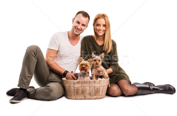 Stock photo: Love Couple with two yorkshire terrier in basket  - autumn fashion 