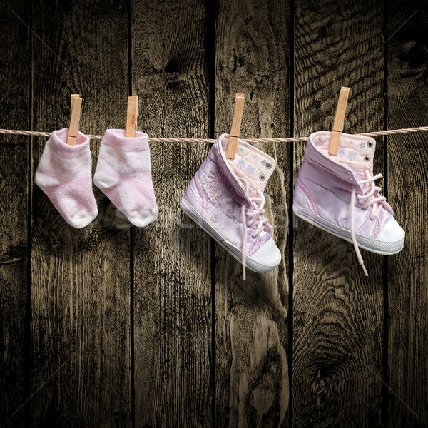 Baby girl shoes and socks on the clothesline Stock photo © Geribody