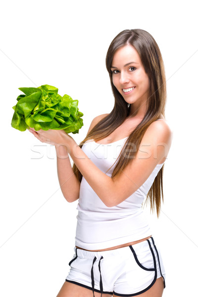Healthful eating-Beautiful fit woman holding a salad. Stock photo © Geribody