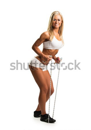 Lovely woman doing fitness exercises with rubber band Stock photo © Geribody