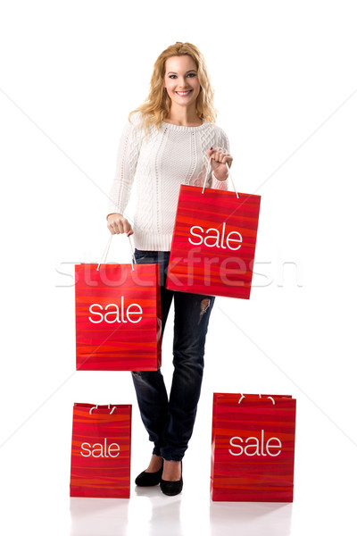 Piękna uśmiechnięta kobieta sprzedaży kobiet szczęśliwy zakupy Zdjęcia stock © Geribody