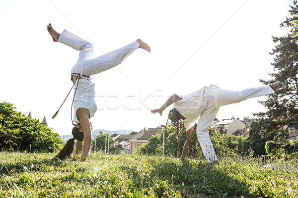 Capoeira couple of awesome stunt outdoors  Stock photo © Geribody