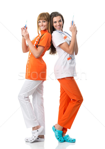 Zdjęcia stock: Dwa · pielęgniarki · jeden · wstrzykiwań · lekarza · szczęśliwy