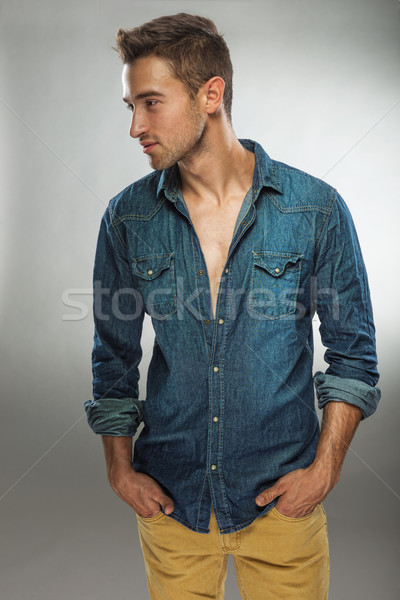 Homem bonito elegante vestir posando jeans moda Foto stock © Geribody