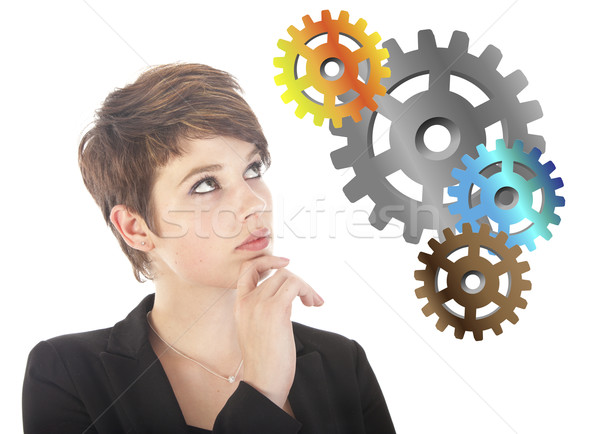 Young woman thinking with gears isolated on white background Stock photo © gigra