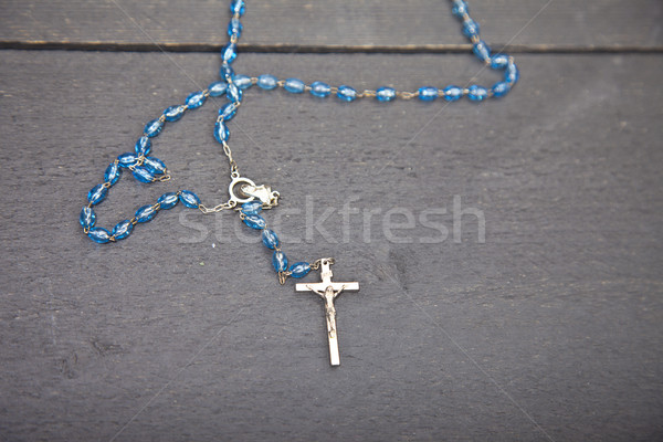 Rosary on dark black wooden background Stock photo © gigra