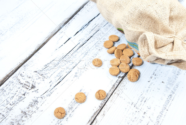 Dutch candy pepernoot with jute bag on white blue wooden background Stock photo © gigra