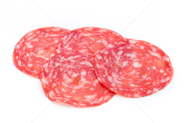 Salami smoked sausage slices isolated on white background cutout Stock photo © gitusik