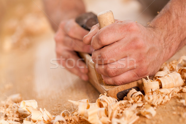woodworker hands shaving with a plane Stock photo © Giulio_Fornasar