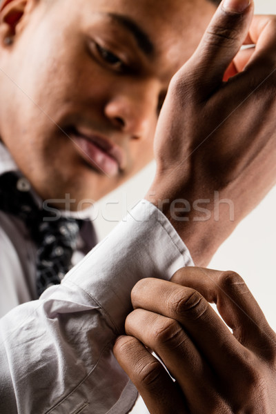 elegant black man adjusting cuff Stock photo © Giulio_Fornasar