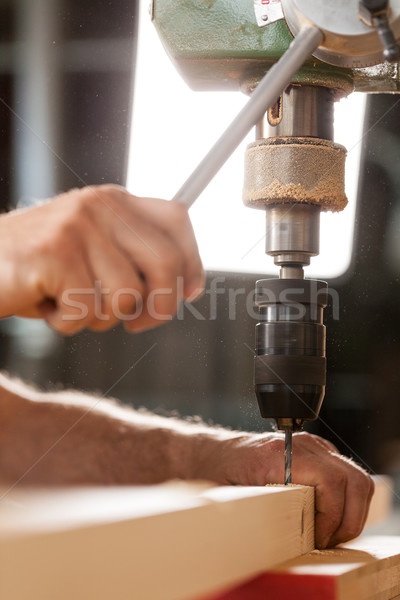 woodworker drilling a plank with machinery Stock photo © Giulio_Fornasar