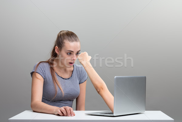 woman scared by an arm reaching out from laptop Stock photo © Giulio_Fornasar