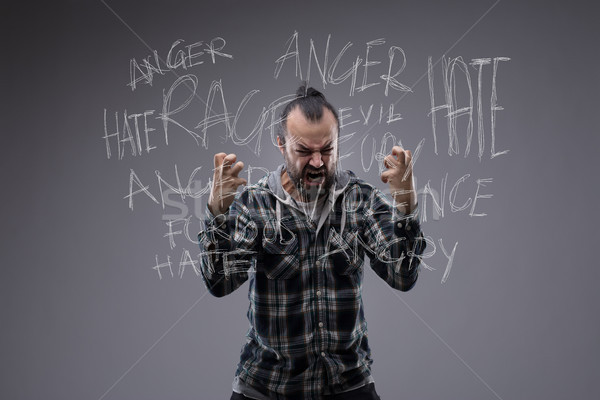 Angry revengeful man in a fit of rage Stock photo © Giulio_Fornasar