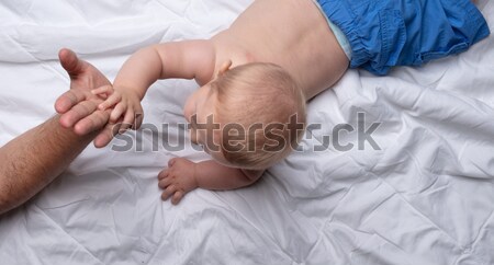 Cute naked little baby lying on its stomach Stock photo © Giulio_Fornasar