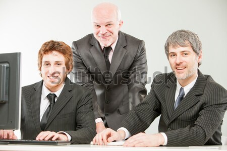 three thrilled businessmen pointing out to you Stock photo © Giulio_Fornasar
