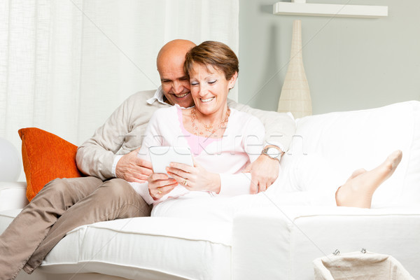 Affectionate middle-aged coupe relaxing at home Stock photo © Giulio_Fornasar
