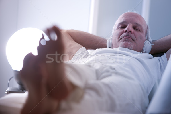 self-confident man relaxing on a sofa Stock photo © Giulio_Fornasar