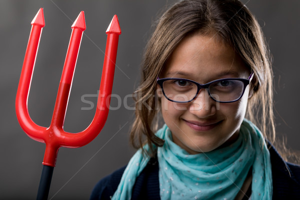 little girl with a big pitchfork Stock photo © Giulio_Fornasar