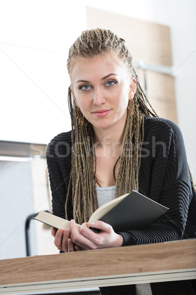 woman in her kitchen reading a book Stock photo © Giulio_Fornasar