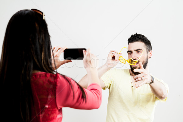 thrilled couple taking mobile photographs and selfies Stock photo © Giulio_Fornasar