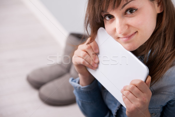 Stock photo: smiling woman with a digital tablet