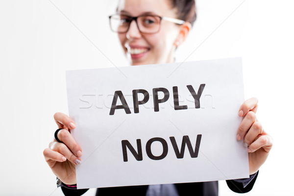 apply now sign hold by a young smiling woman Stock photo © Giulio_Fornasar