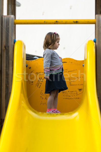 little girl on a slide watching something Stock photo © Giulio_Fornasar