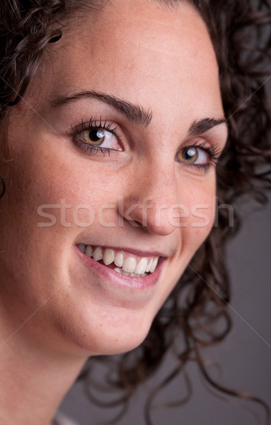 foreground portrait of a smiling curly haired woman Stock photo © Giulio_Fornasar