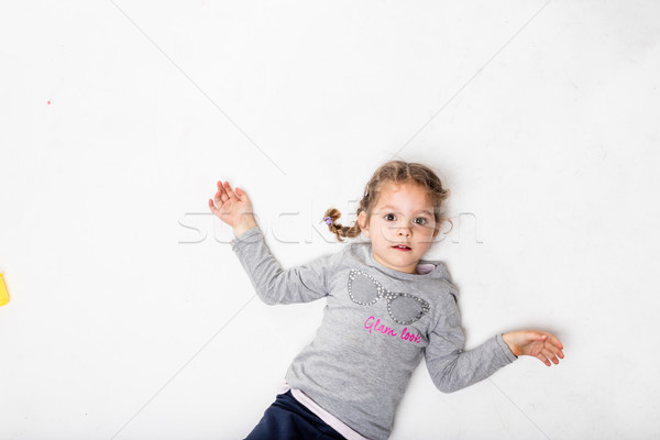 little girl on a slightly dirty white background Stock photo © Giulio_Fornasar