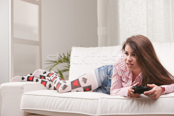 pretty girl playing videogames at home Stock photo © Giulio_Fornasar