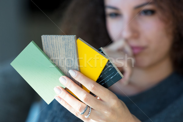 Young woman contemplating color swatches Stock photo © Giulio_Fornasar