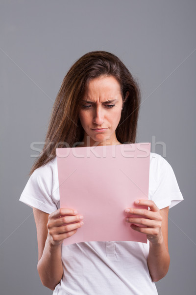 женщину Плохие новости розовый лист довольно Сток-фото © Giulio_Fornasar