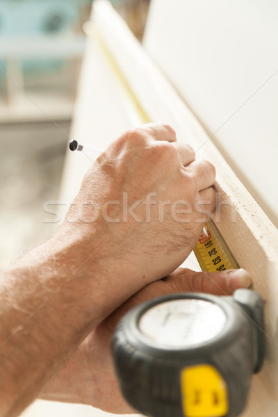 woodworker artisan in his workshop measuring Stock photo © Giulio_Fornasar