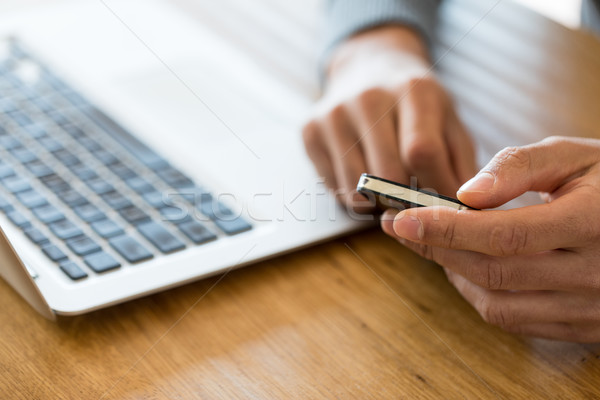 Cropped of male holding black cell phone Stock photo © Giulio_Fornasar